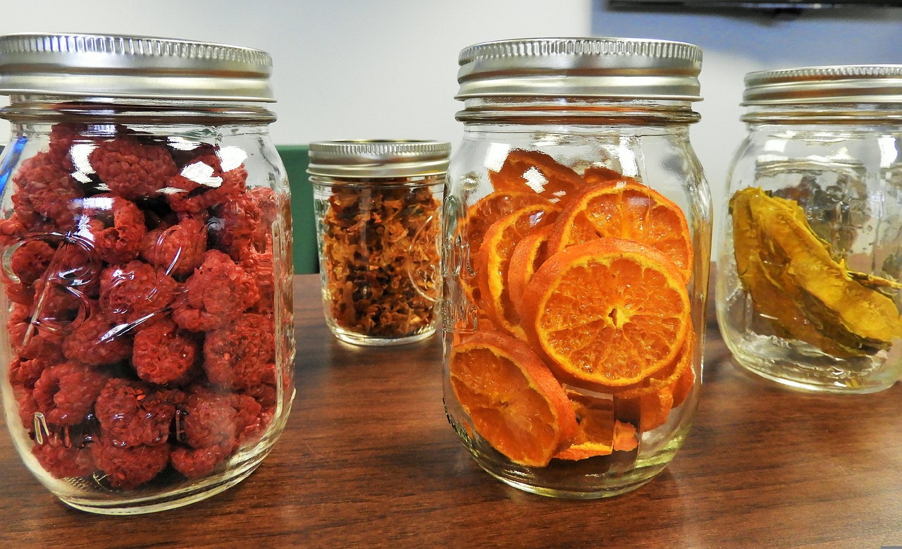 Jars and staples arranged on pantry shelves