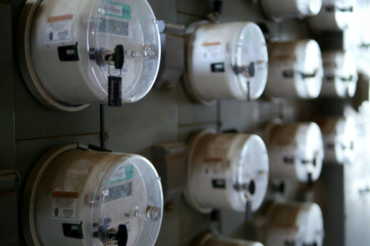 A residential electric meter mounted on a house wall
