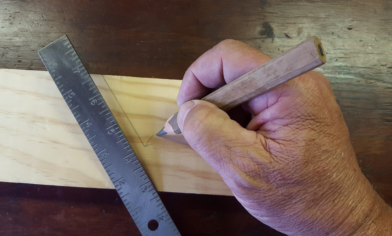 Hand tools laid out on a wooden workbench